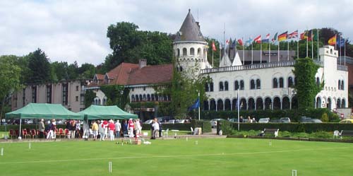 Photo of Hotel Chateau du Lac with croquet lawns in foreground.