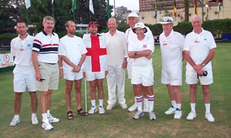 Photo of the nine English competitors in Cairo. Richard Brand has the English flag wrapped around him.