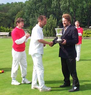 Photograph of the Belgian Open trophy being presented