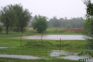 Photo of one of the Busto Arsizio croquet lawns near Milan completely submerged in rainwater.